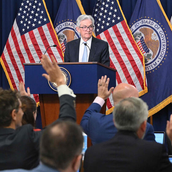 Federal Reserve Board chairman Jerome Powell answering questions at a news conference.