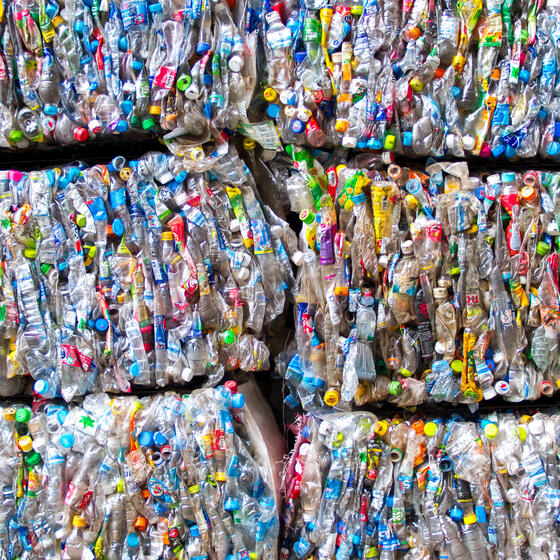 Bundles of crushed plastic containers
