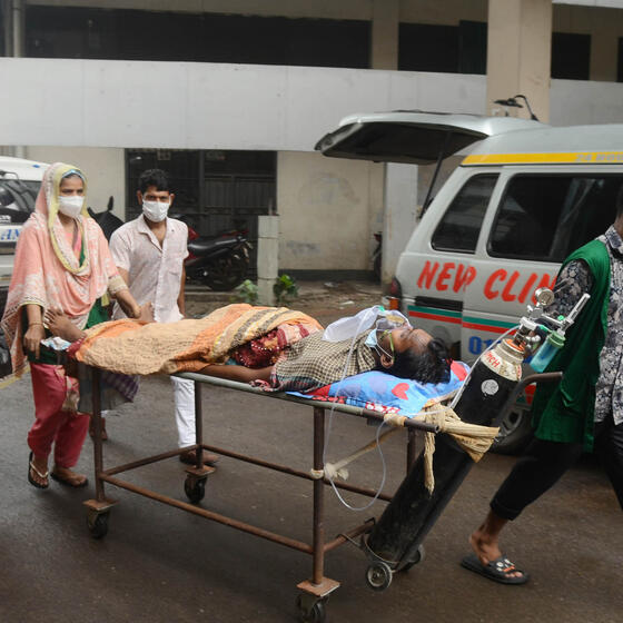 A COVID-19 patient is taken to a hospital in Dhaka, Bangladesh, in July 2021.