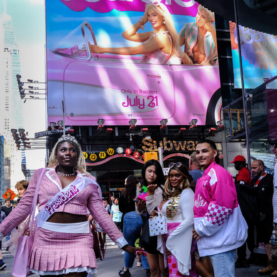 Fans in New York’s Times Square wearing Barbie clothes for the opening of Barbie movie on July 21, 2023.