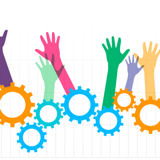 An illustration showing raised hands emerging from a set of gears