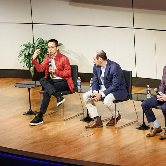 Speakers on stage at the Responsible AI in Global Business Conference