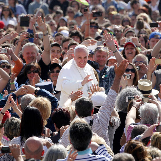 Pope Francis greeting a crowd in St. Peter’s Square
