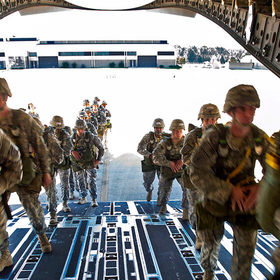 Soldiers boarding a transport plane