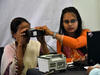 A woman having her eyes scanned at an Aadhaar registration office in Guwahati, India, in 2018. Photo: David Talukdar/NurPhoto via Getty Images.