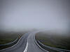 A road disappearing into fog