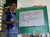 A speaker in front of a whiteboard in the Philippines