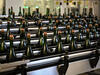 Champagne bottles on an automated assembly line