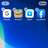 A group of apps for Google, Amazon, Apple, and Facebook in "jiggle mode," with delete buttons on each one