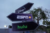 Directional signs with logos for Disney+, Hulu, and ESPN+.