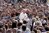 Pope Francis greeting a crowd in St. Peter’s Square