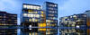 A photo of corporate headquarters campus reflected in water